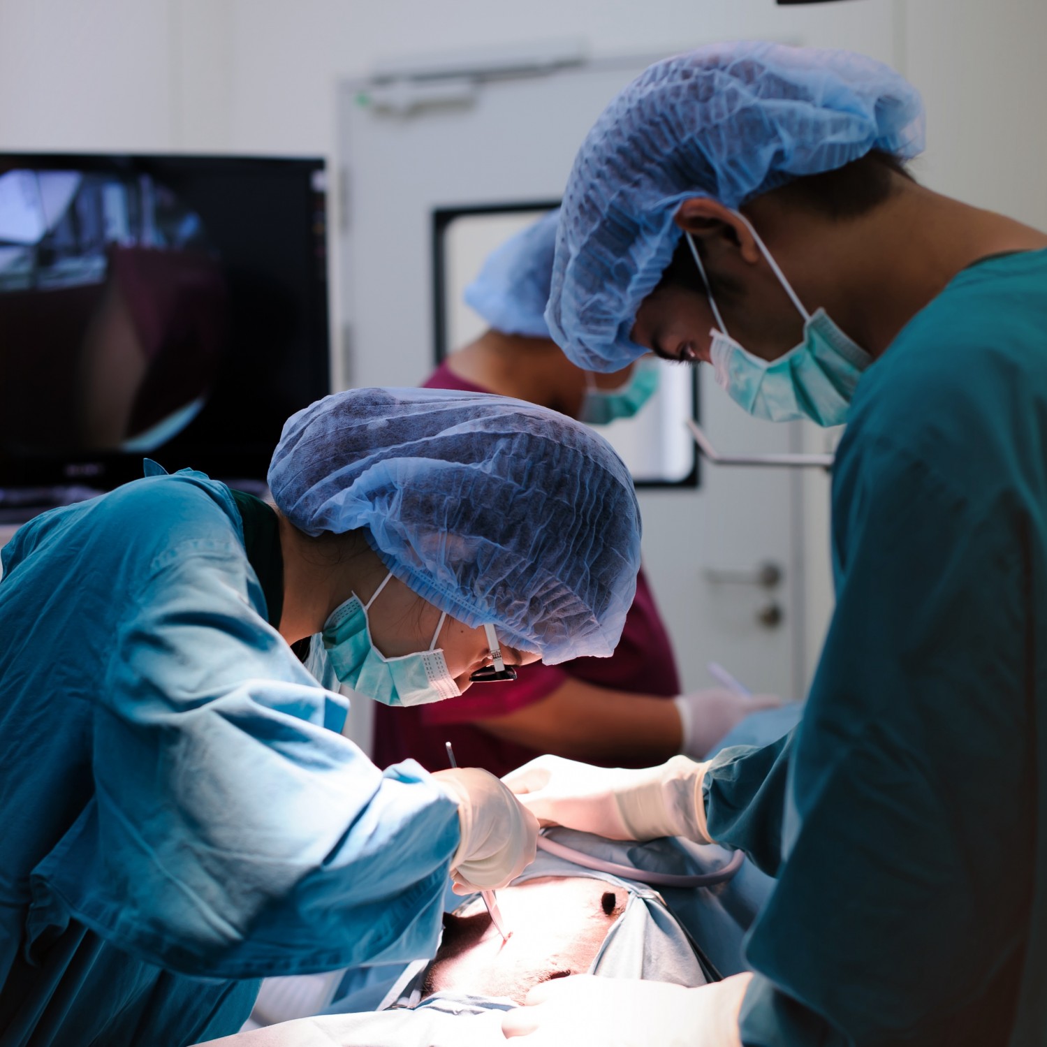 Doctors Performing Surgery